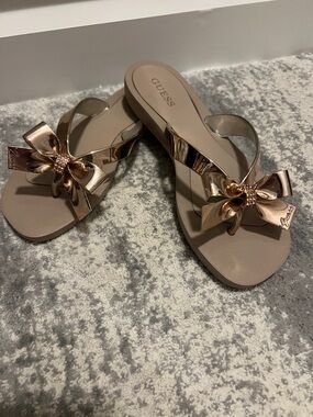GUESS Rose Gold Metallic Bow Thong Sandals with Taupe Footbed